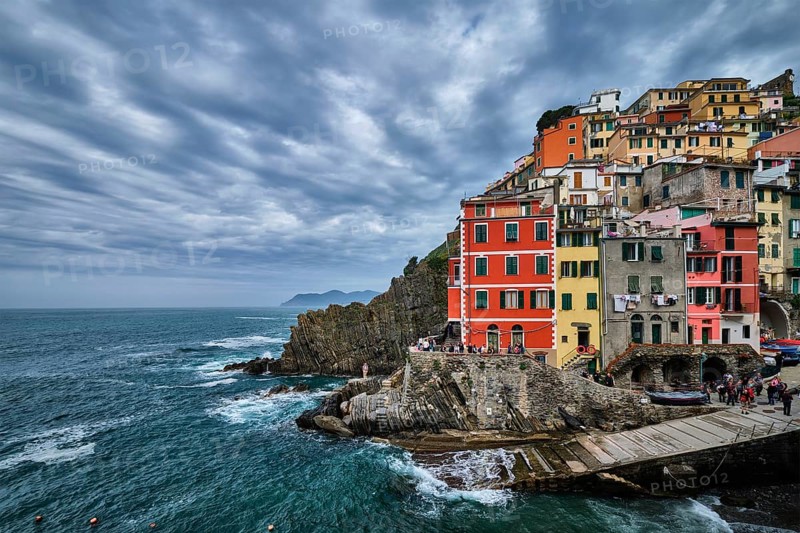 RIOMAGGIORE, ITALY, APRIL 25, 2019: Riomaggiore village popular tourist destination in Cinque Terre National Park a UNESCO World Heritage Site, Liguria, Italy in stormy weather