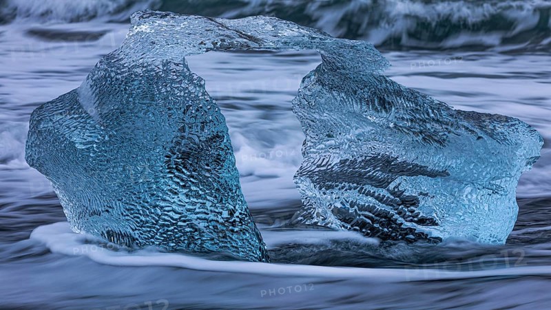 Artfully shaped iceberg on the black beach of Breidamerkursandur, near Jökullsarlon, Sudurland, Iceland, Europe