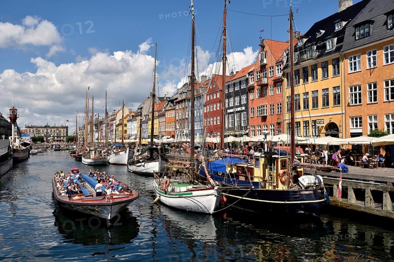 Excursion boats on canal in front of colorful facades, Nyhavn, Copenhagen, Denmark, Europe