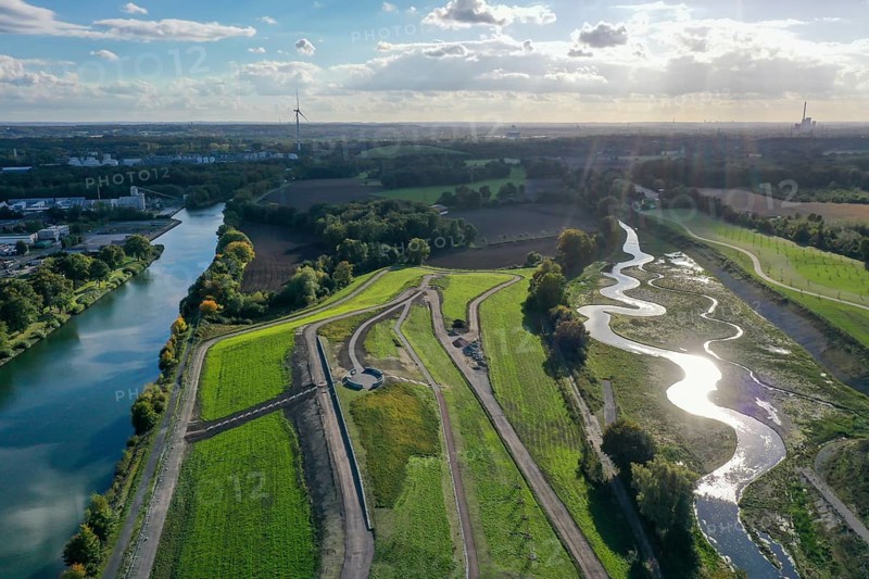 Recklinghausen, Castrop-Rauxel, North Rhine-Westphalia, Germany, Renaturalised Emscher, EMSCHERLAND construction project, a 37-hectare water and nature discovery park at the water crossroads of the Rhine-Herne Canal (left) and the renaturalised Emscher (right) on the city limits of Recklinghausen and Castrop-Rauxel. The ecological focal point at the confluence of Suderwicher Bach and Emscher will also be a future garden for the International Garden Exhibition 2027. Before the renaturalisation, the Emscher river system was an open, above-ground wastewater channel, combined sewer with surface water and wastewater, Europe