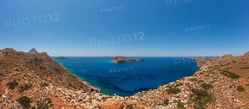 Hikers on the way to the cape of the Gramvousa peninsula with a view of the island of Imeri Gramvousa, Kolimbari, West Crete, Crete, Greece, Europe