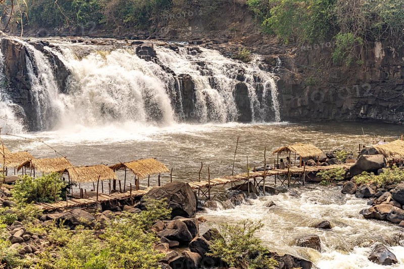 Wooden bridge at the Tad Lo waterfall in the Bolaven Plateau, Laos, Asia