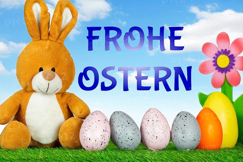 Easter greetings: Easter bunny with colourful Easter eggs with text FROHE OSTERN (Composing)