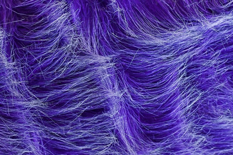 Close up of purple synthetic fake fur with white tips