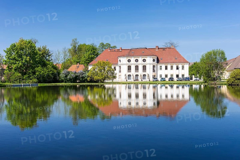 Baroque castle with reflection in the large pond, Königswartha, Upper Lusatia, Saxony, Germany, Europe