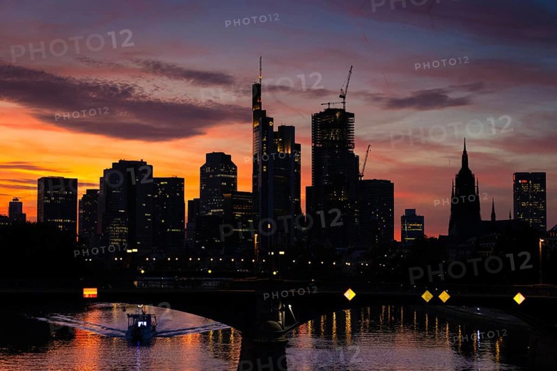 The silhouette of Frankfurt's banking skyline stands out against the luminous evening sky in the evening after sunset., Frankfurt am Main, Hesse, Germany, Europe