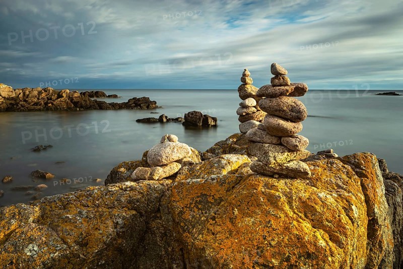 Rocky coast with cairns in the morning light, Allinge-Sandvig, Bornholm, Denmark, Europe
