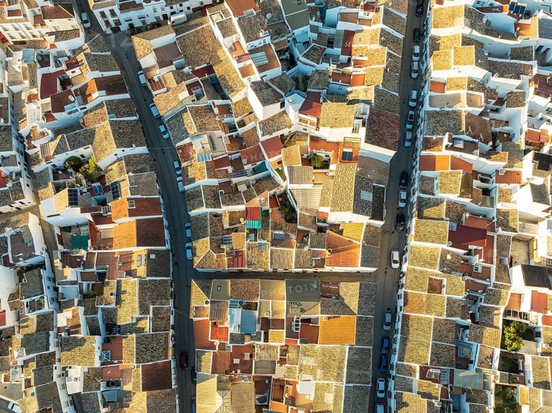 Streets and rooftops in the White Town of Olvera. Aerial view. Drone shot. Cádiz province, Andalusia, Spain, Europe