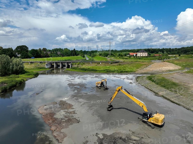 Dortmund / Castrop-Rauxel, North Rhine-Westphalia, Germany, river renaturalisation, renaturation of the Emscher, flood retention basin HRB Mengede. A new floodplain landscape is being created at the Emscher-Auen farm, expanding the area for flood protection during heavy rainfall and for biodiversity. The Emscher, which is currently straightened, will be given curves again and can meander through its new floodplain. Following the construction of a parallel sewer, the Emscher has been completely free of wastewater since 2022. The river was previously an open, above-ground mixed water channel with rainwater and wastewater. At the back right, the Uniper coal-fired power plant Datteln 4 power station, Europe
