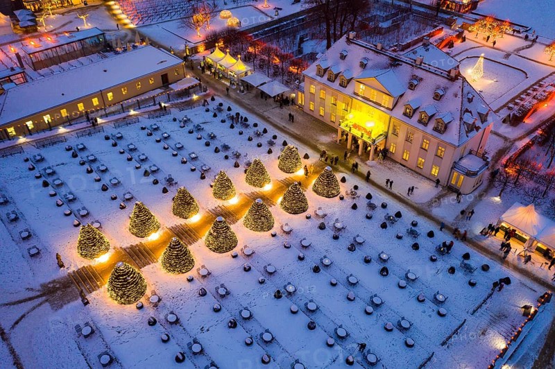 Aerial view of Wackerbarth Castle with castle park in snow and Christmas lights, Radebeul, Saxony, Germany, Europe