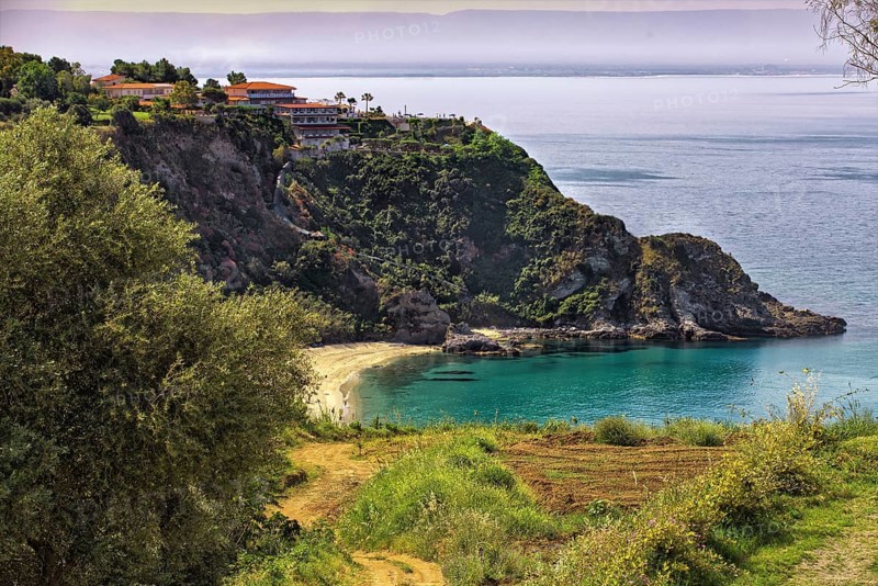 Coastal landscape with steep cliffs and blue sea. Quiet and idyllic atmosphere, Capo Vaticano, Italy, Europe