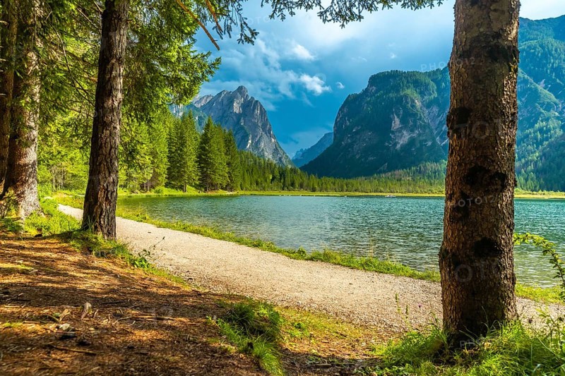 Wonderful alpine landscape showing lake dobbiaco with the dolomites in the background, in summer, italy
