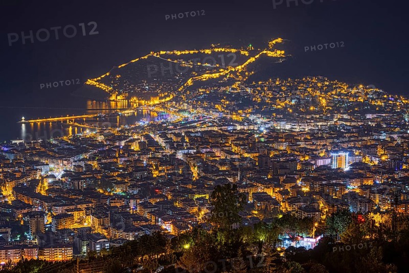 The lights of the city of Alanya on the Turkish Riviera glow in the evening, Alanya, Antalya, Turkey, Asia