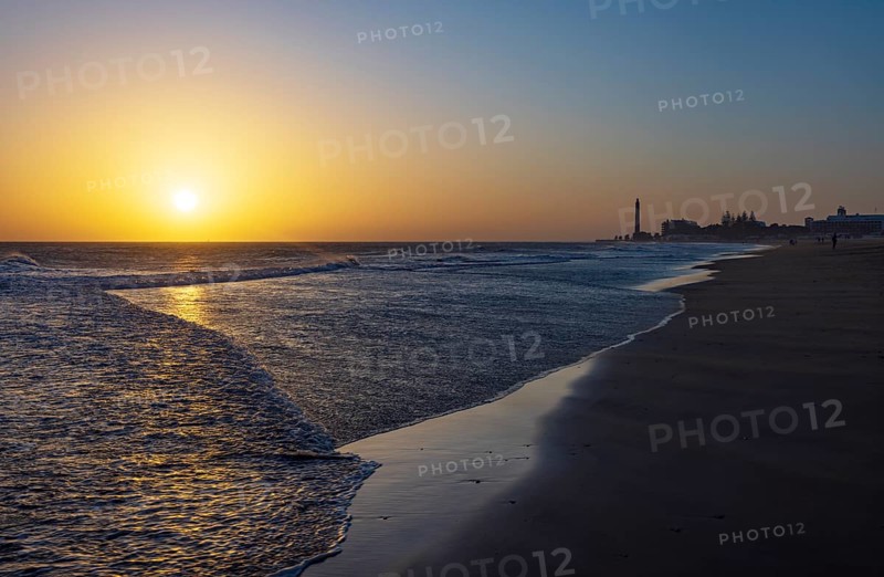 Sunset at the beach of Maspalomas with lighthouse Faro de Maspalomas, Gran Canaria, Canary Islands, Spain, Atlantic Ocean, Europe