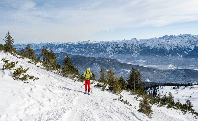 Ski tourers climbing Simetsberg, view of mountain panorama, Estergebirge, Bavarian Prealps, Bavaria Germany