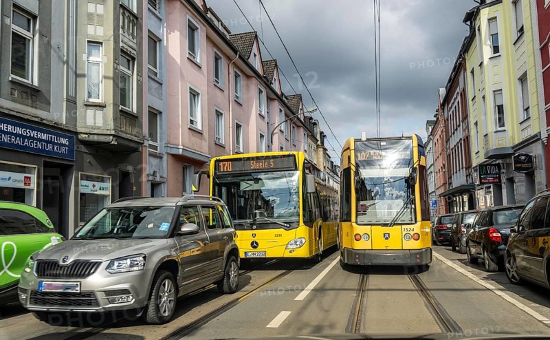 Tram and bus in traffic, on the street Schonnebeckhöfe in Essen-Katernberg, North Rhine-Westphalia, Germany, Europe