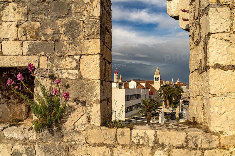 View through the battlements of Kamerlengo Fortress to the old town centre of Trogir, Croatia, Europe