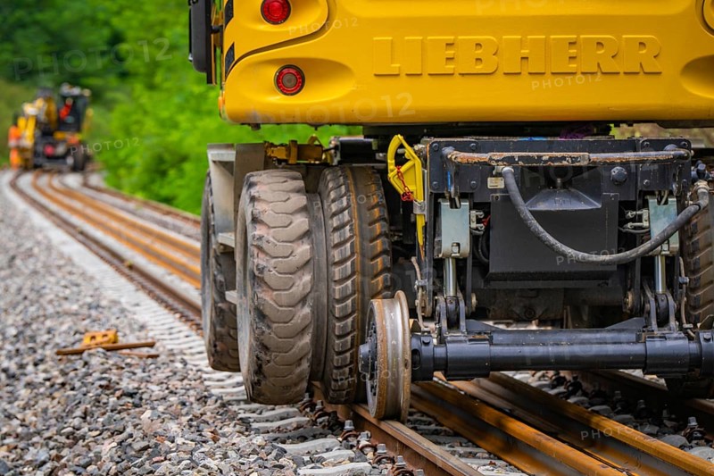 Close-up of the tyres of a yellow construction machine on rails, track construction, Hermann Hessebahn, Calw, Black Forest, Germany, Europe