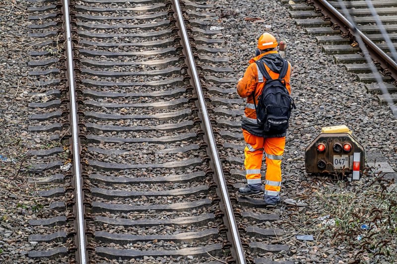 Worker on the railway tracks, after the end of his shift, walking home from the tracks, North Rhine-Westphalia, Germany, Europe