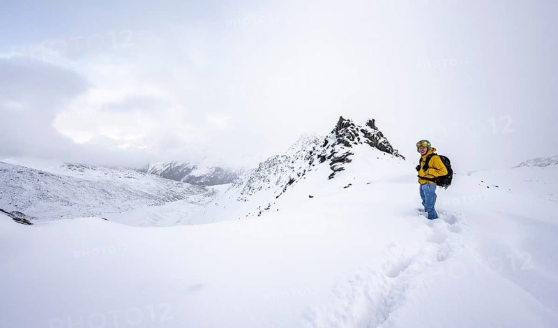 Ski tourers in a wintry mountain landscape in fresh snow, Ortler Alps, Vinschgau Valley, Italy, Europe
