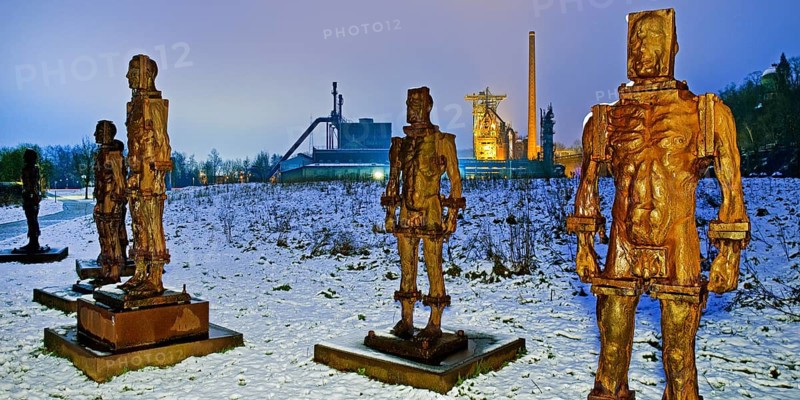 People made of iron, multi-part iron sculpture by Zbigniew Fraczkiewicz in front of the Henrichshütte in winter, Hattingen, Ruhr area, Germany, Europe