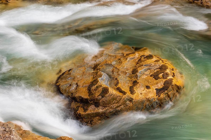 The Riss creek flowing through an autumnal landscape in the Eng valley