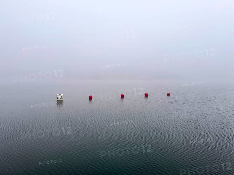Buoys for water sports in dense fog on Lake Baldeney in Essen, foggy weather in winter, North Rhine-Westphalia, Germany, Europe