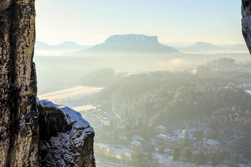 View from the Bastei bridge into the misty Elbe valley with the spa town of Rathen and Lilienstein, Saxon Switzerland, Saxony, Germany, Europe