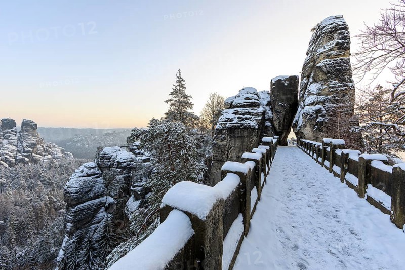 Snow on the Bastei bridge, rock gate and rock castle Neurathen in the morning, Saxon Switzerland, Saxony, Germany, Europe