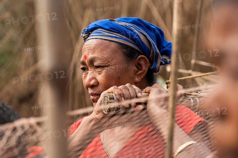 Villagers participate in a community fishing event on the occasion of the Bhogali Bihu festival at Panbari village in Assam on 13 January 2025. Magh Bihu, also known as Bhogali Bihu, is one of the most vibrant festivals celebrated in Assam and other parts of Northeast India