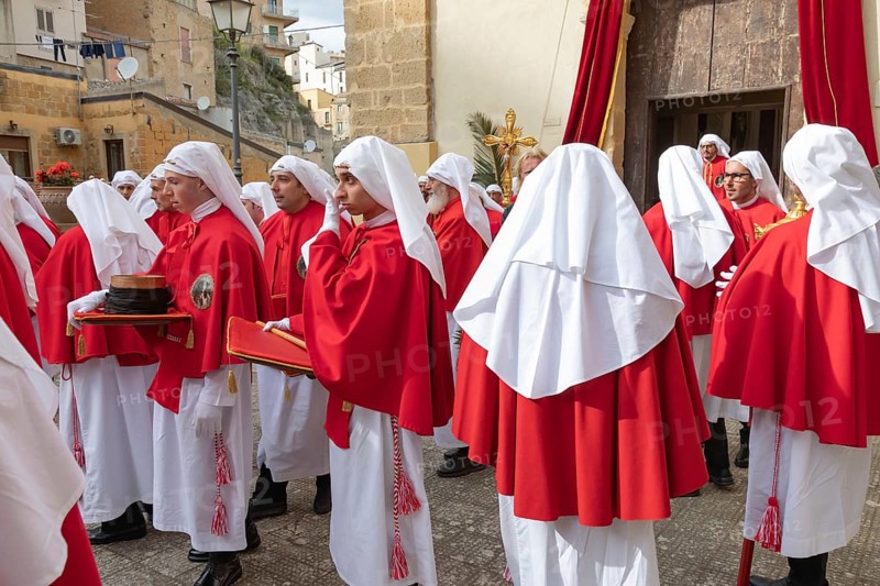 Confraternity of penitents gathering outside San Leonardo church, Enna, Siclly, Italy, Europe