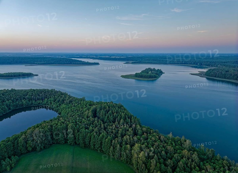 Aerial view of Lake Wigry and the landscape in the Wigry National Park in northern Poland in the evening light. Krusznik, Podlaskie, Poland, Europe