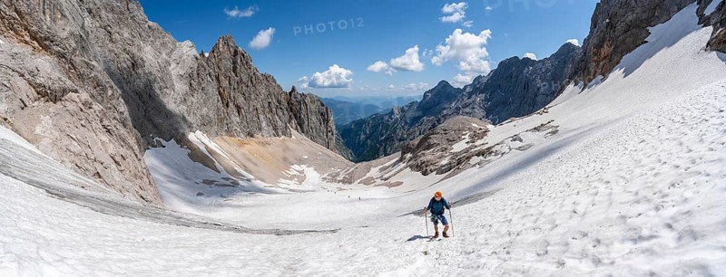 Panorama, mountaineer on a snowfield, mountain basin with glacier remnant of the Höllentalferner, Höllental, rocky mountain peaks, Höllental, Bavaria, Germany, Europe