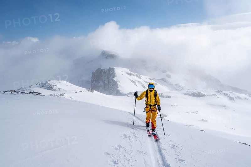 Ski tourers in a snowy mountain landscape, ascent to the Wildhorn, cloudy mood, high tour, Bernese Alps, Bernese Oberland, Switzerland, Europe