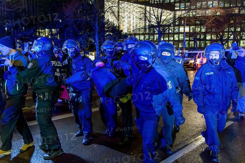 Police clear the protests in front of the Axel Springer skyscraper against the World Economic Summit, a political lobby meeting with guests such as Elon Musk, Alice Weidel and Friedrich Merz, Berlin, 27 January 2025