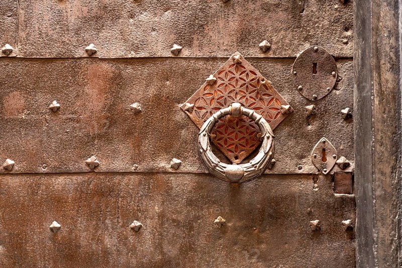 Metal door knocker, in Finalborgo, Finale Ligure, Riviera di Ponente, Liguria, Italy, Europe