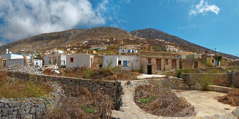 The traditional and idyllic mountain village of Avlona with stone houses and dry vegetation, Avlona, Diafani, Karpathos, Greece, Europe