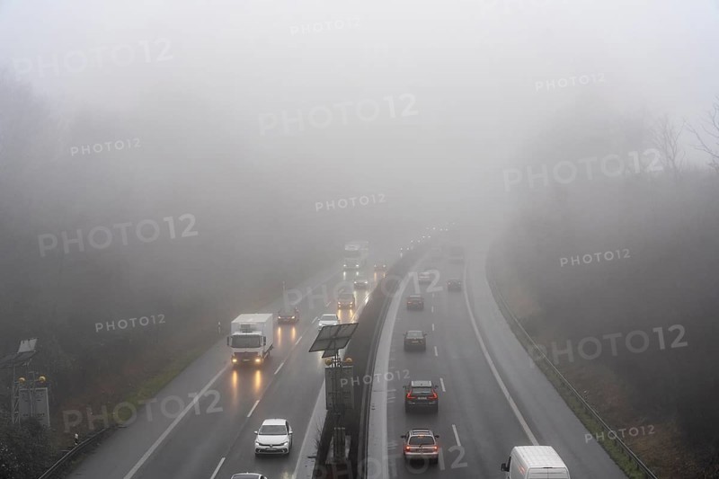 Dense fog, with visibility sometimes less than 100 metres, A52 motorway, in Essen, North Rhine-Westphalia, Germany, Europe
