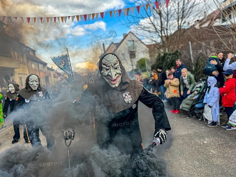 Hofener Hogamale with smoke bomb at the big carnival parade of the Hofener Scillamännle, Hofen, Stuttgart, Baden-Württemberg, Germany, Europe