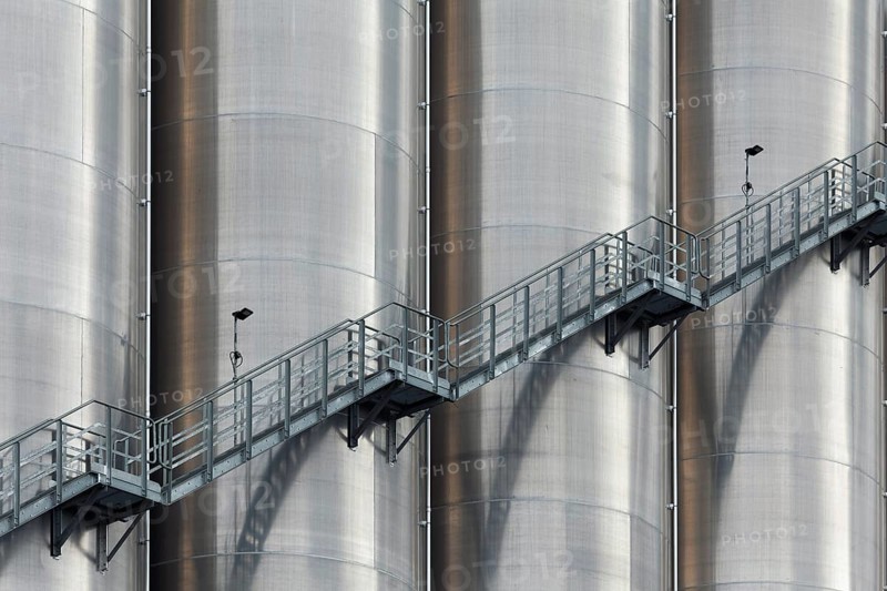 High silo facility for bulk goods, aluminium silo with external staircase, Parallelhafen, Duisburg-Neuenkamp, North Rhine-Westphalia, Germany, Europe