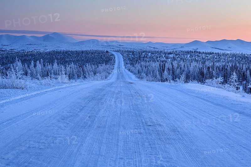 Snow-covered gravel road, highway, ice, snow, cold, mountain landscape, winter, morning mood, Dempster Highway, Yukon, Canada, North America