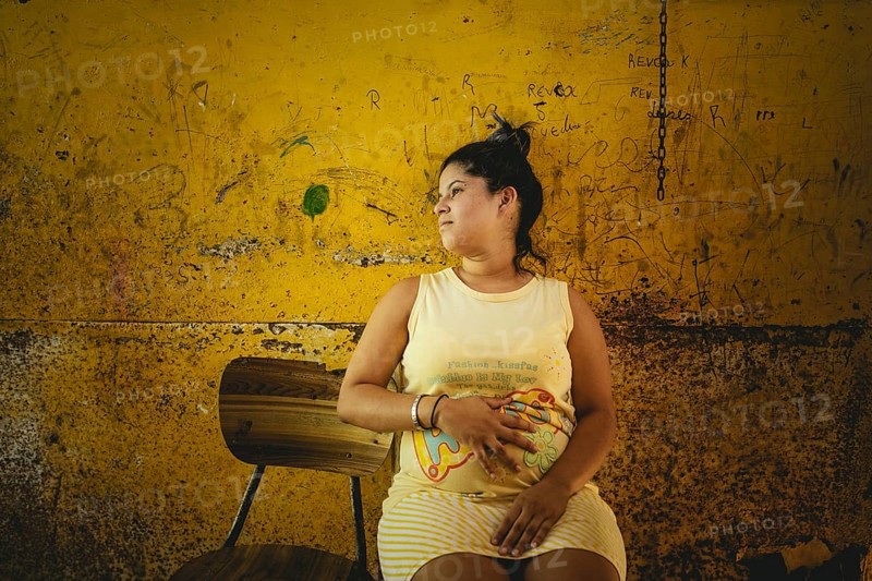Rosalba, 18 years old, was recruited into prostitution at 14, last year she became pregnant, she is 8 months pregnant. She is currently living back in her family's hut in Túrgua, Venezuela, South America