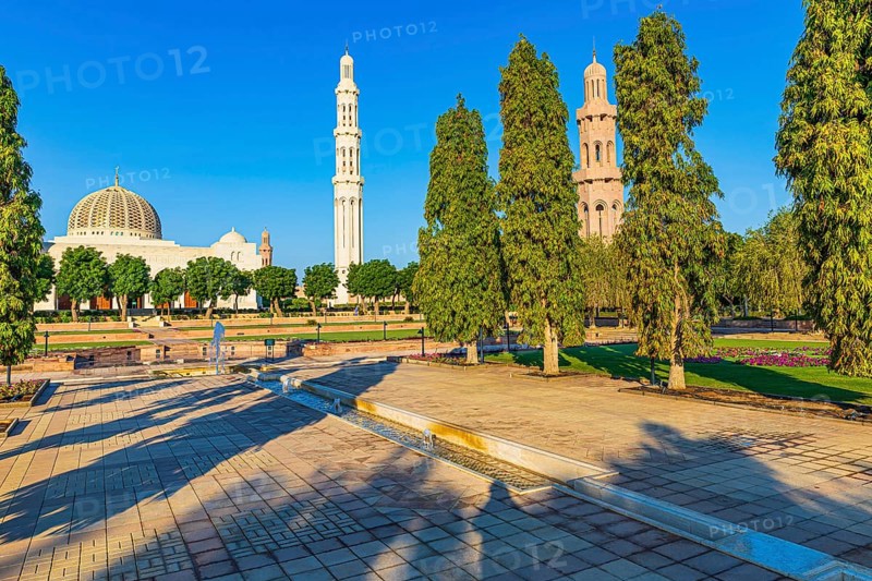 Park of the Sultan Qaboos Mosque, behind the mosque with the domes and minarets, Muscat, Arabian Peninsula, Sultanate of Oman