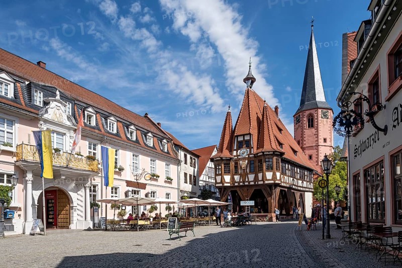 Baroque Löwenhof, Gasthaus Zum goldenen Löwen and Posthalterei von Thurn und Taxis, post office, old town hall, late medieval half-timbered building, Gothic, cultural monument, bell tower of the town church, street café, pedestrian zone, market square, historic old town, contrails, Michelstadt, Odenwald, Hesse, Germany, Europe