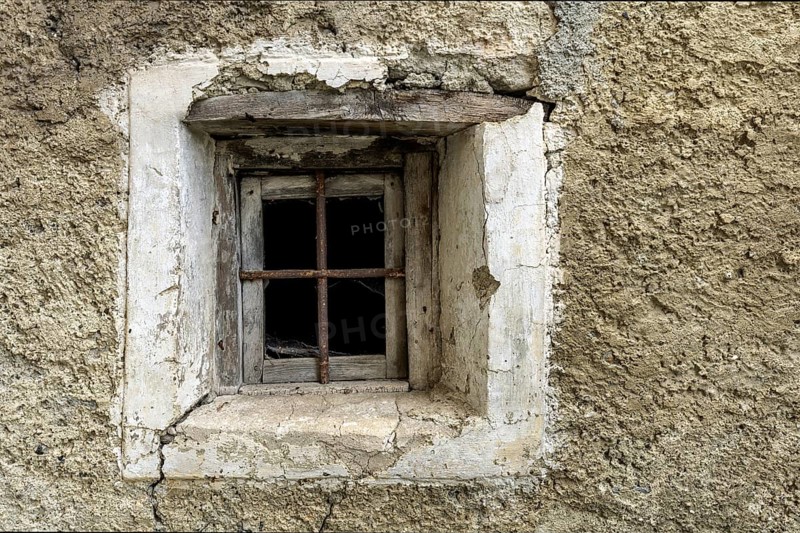 Dilapidated window of an old house in the mountain village of Bordei, Centovalli, Canton Ticino, Switzerland, Europe