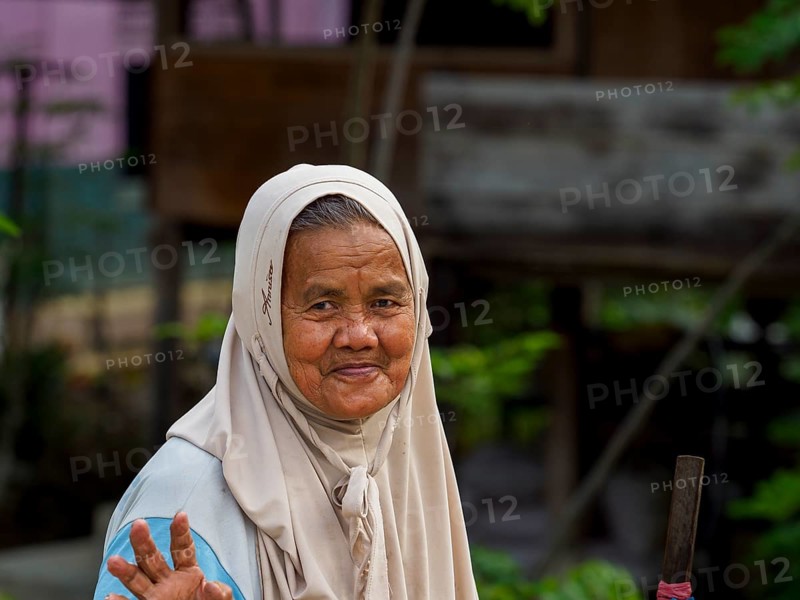 Old muslim woman, laughing with stick, Sulawesi, Indonesia, Asia