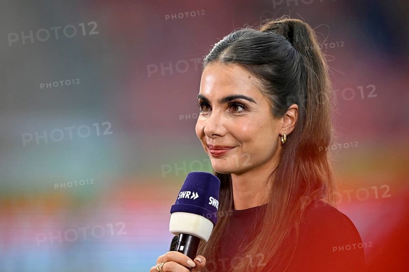 TV presenter Lea Wagner in an interview, microphone, logo, SWR, portrait, smiles, Voith-Arena, Heidenheim, Baden-Württemberg, Germany, Europe