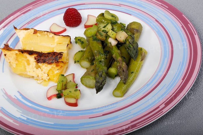 South German cuisine, green asparagus with rhubarb vinaigrette and potato gratin, healthy, vegetables, plated, vegetarian, traditional cuisine reinterpreted, food photography, studio, Germany, Europe