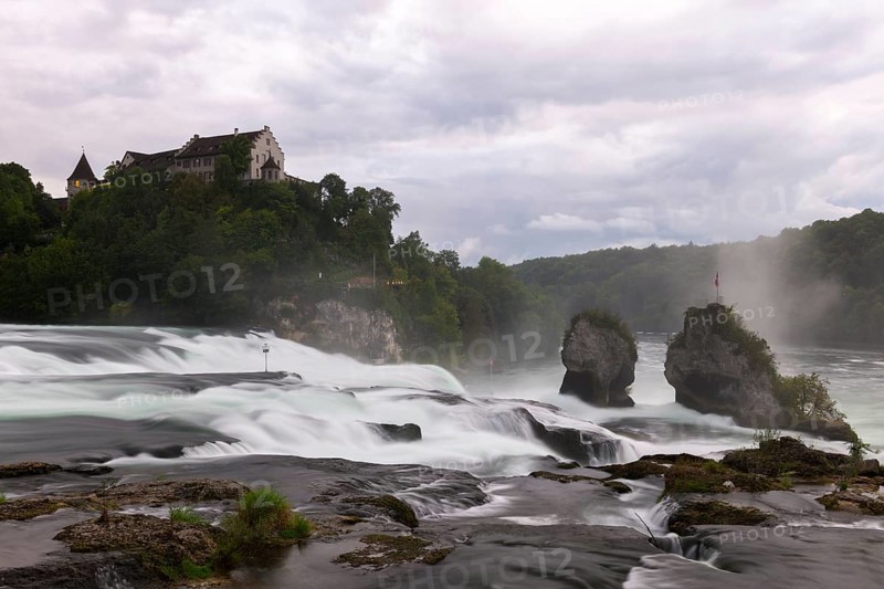 Majestic waterfall with castle in the background, Schloss Laufen, Rhine Falls, Canton Schaffhausen, Switzerland, Europe