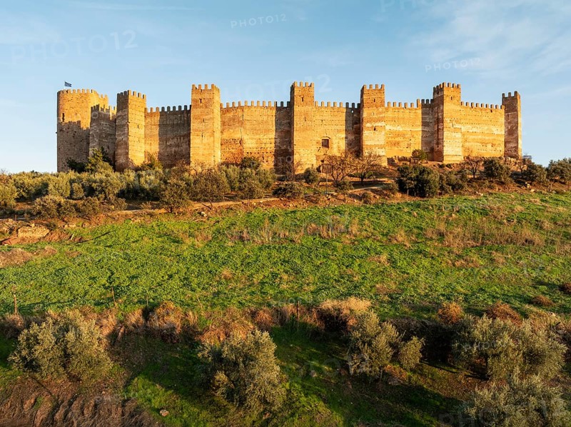 The impressive Moorish Burgalimar castle at the town of Baños de la Encina. Drone shot. Jaén province, Andalusia, Spain, Europe